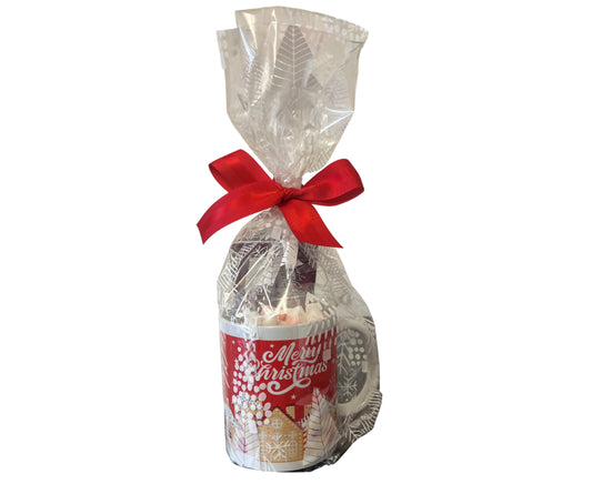 Gift mug with a red ribbon and 'Merry Christmas' label on a white background