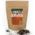Kraft paper bag of Miles Tea Company festive blend orange spiced tea with loose leaf tea on a white background