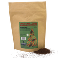 A brown kraft paper stand-up pouch labeled 'Christmas Coffee' with a green front label showing spices and a Christmas tree, with loose ground coffee scattered in front on a white background.