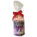 A packaged hot chocolate gift set in a clear cellophane bag tied with a red ribbon, showing a chocolate tin with marshmallows inside, on a plain white background.
