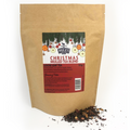 Kraft paper bag of Christmas mulled tea blend with a label on a white background