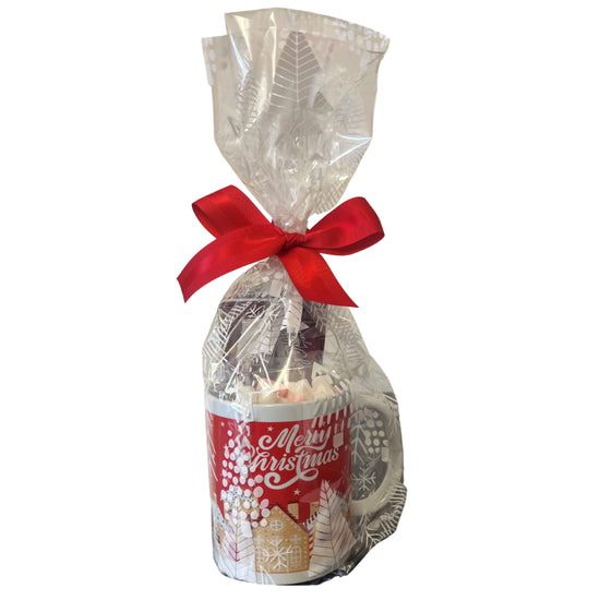 Gift mug with a red ribbon and 'Merry Christmas' label on a white background
