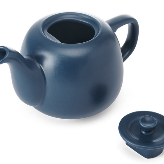 Blue ceramic teapot with a matching lid on a white background