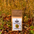 Miles Autumn Equinox loose leaf tea package in a natural setting with grass and leaves.