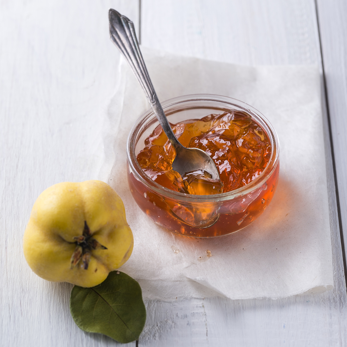 Homemade quince fruit and Miles Earl Grey Tea Jelly in glass jar